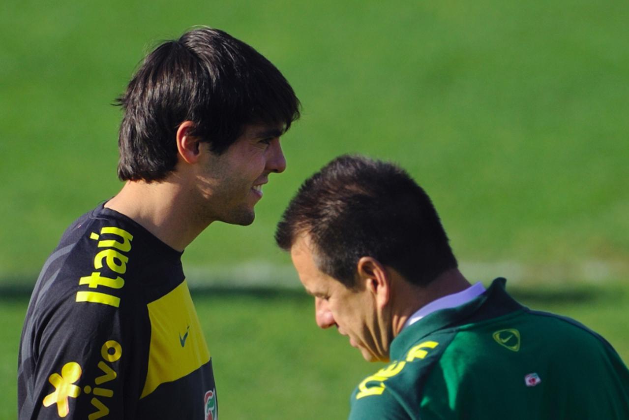 'Brazil\'s football player Kaka (L) stands next to team coach Dunga during a training session at the Randburg High School on June 6, 2010 in Johannesburg ahead of the kick off of the South Africa 2010