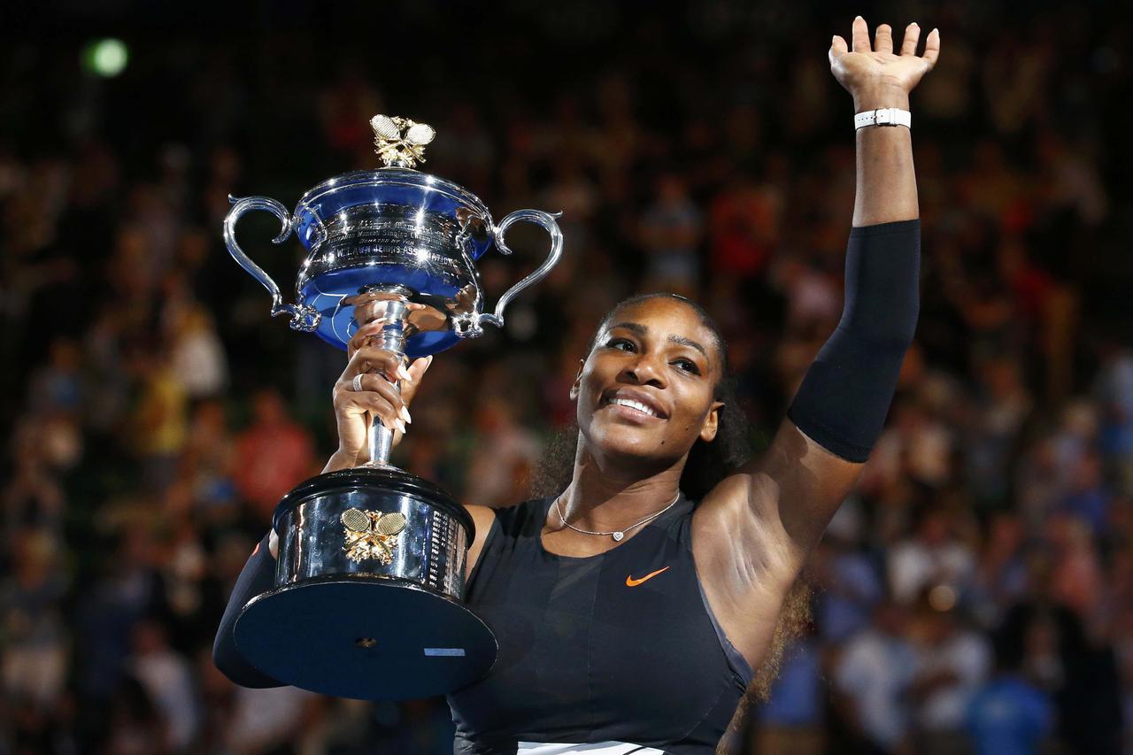 Tennis - Australian Open - Melbourne Park, Melbourne, Australia - 28/1/17 Serena Williams of the U.S. holds her trophy after winning her Women's singles final match against Venus Williams of the U.S. .REUTERS/Edgar Su