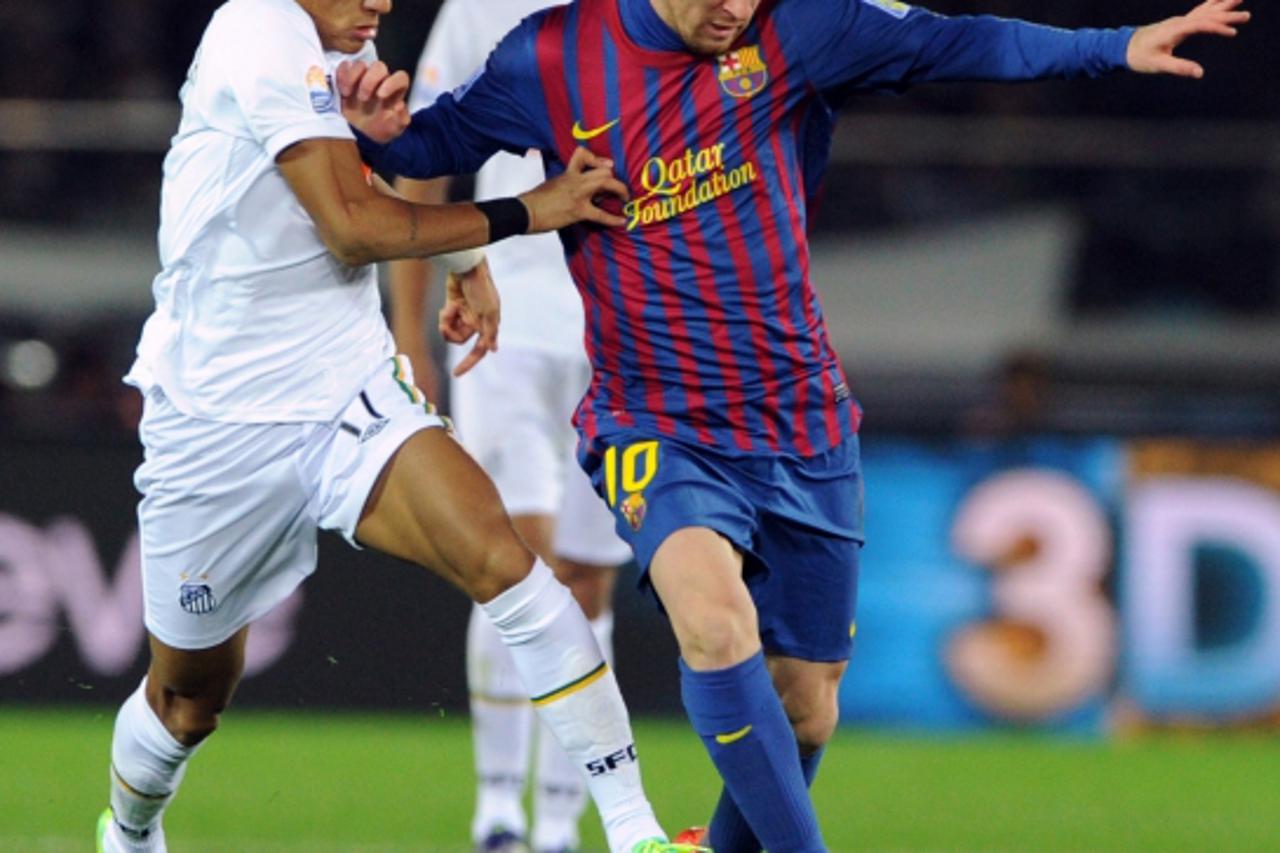 'FC Barcelona forward Lionel Messi (R) fights for the ball with Santos FC forward Neymar (L) during the Club World Cup football final match in Yokohama on December 18, 2011. Barcelona beat Santos by 4