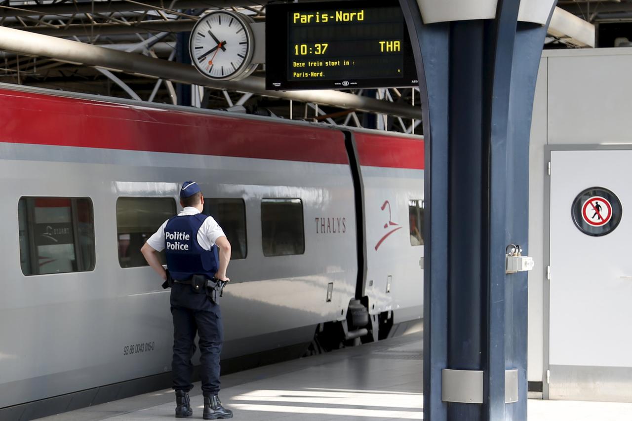 A Belgian police officer stands guard on a platform at the Thalys high-speed train terminal at Brussels Midi/Zuid railway station, August 22, 2015. A machine gun-toting attacker wounded three people on a high-speed train in France on Friday before being o