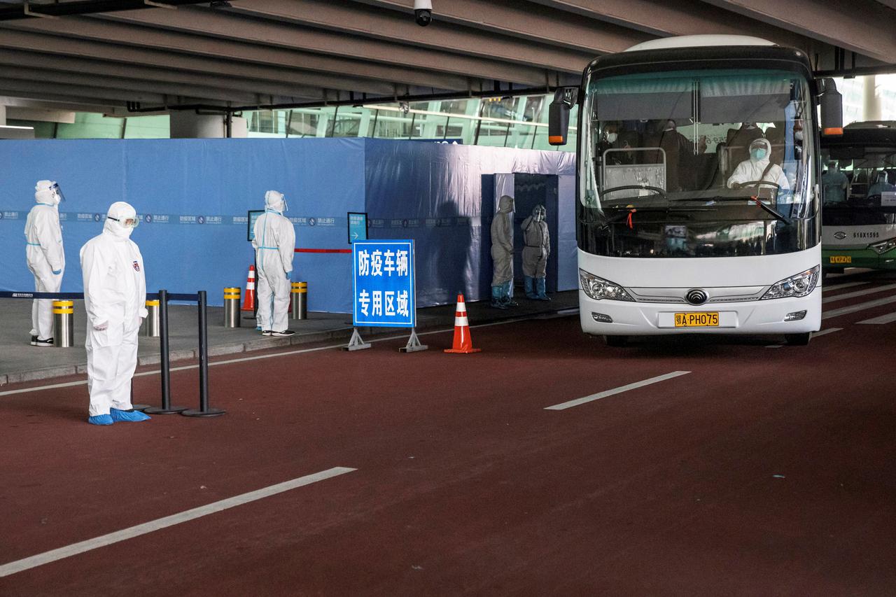Members of the WHO team tasked with investigating the origins of the coronavirus disease (COVID-19) pandemic in Wuhan