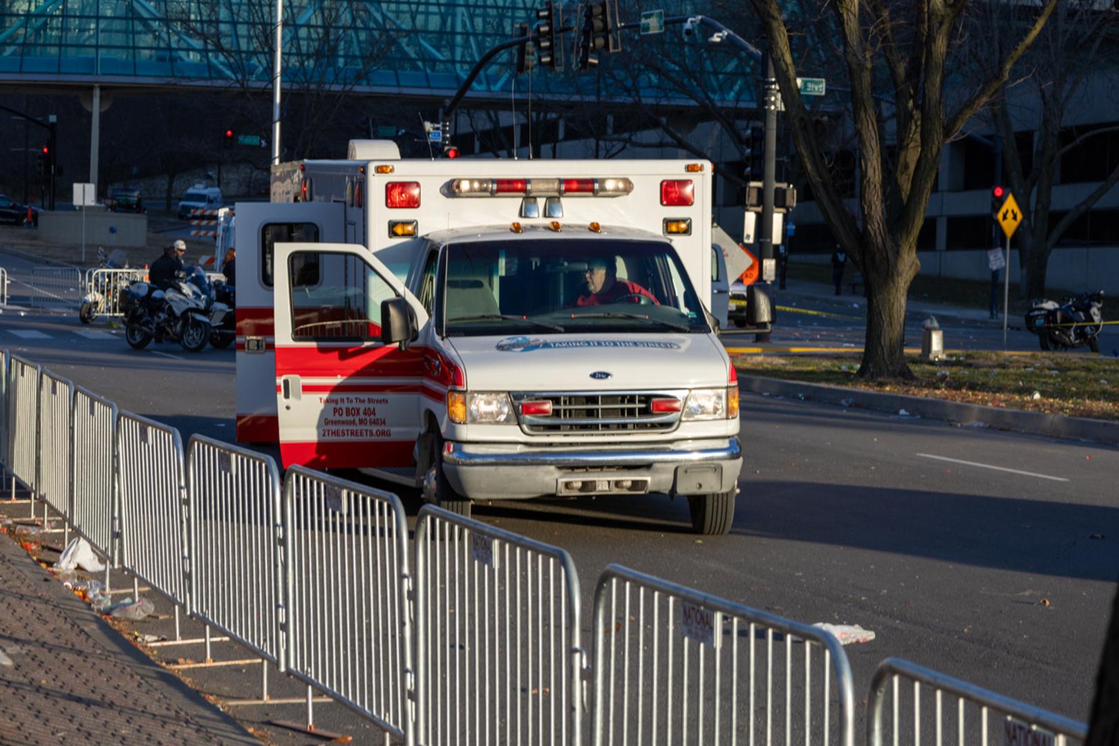 (240215) -- KANSAS CITY, Feb. 15, 2024 (Xinhua) -- This photo taken on Feb. 14, 2024 shows an ambulance waiting at the site following a shooting in Kansas City, Missouri, the United States. At least one person was killed and 22 were injured as gunfire erupted during the Kansas City Chiefs' Super Bowl victory parade in Kansas City, U.S. state of Missouri, Stacey Graves, chief of the Kansas City Missouri Police Department, said at a news conference on Wednesday afternoon. (Photo by Robert Reed/Xinhua) Photo: Robert Reed/XINHUA