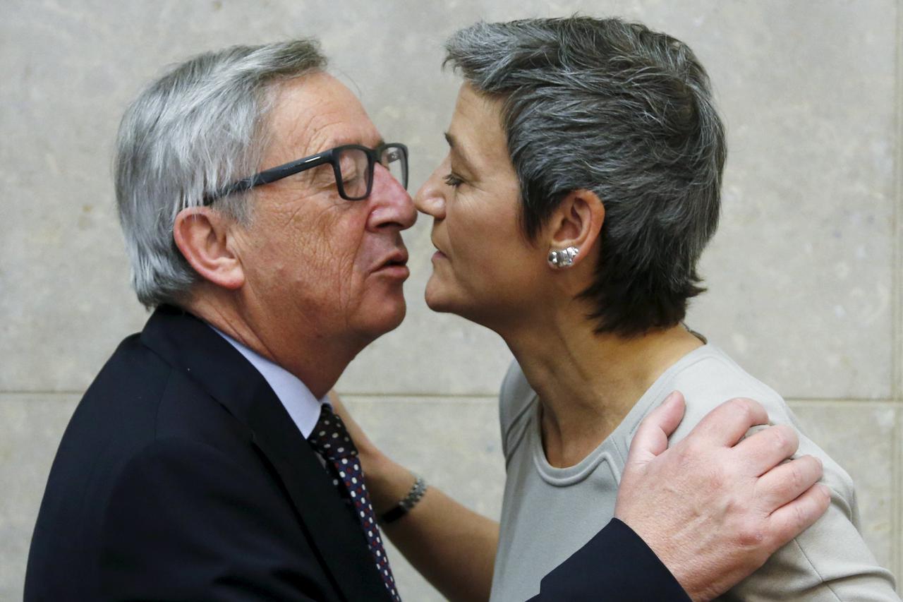 European Commission President Jean-Claude Juncker greets EU Competition Commissioner Margrethe Vestager (R) during a meeting of the EU's executive body at the EU Commission headquarters in Brussels April 15, 2015. The European Union will accuse Google Inc