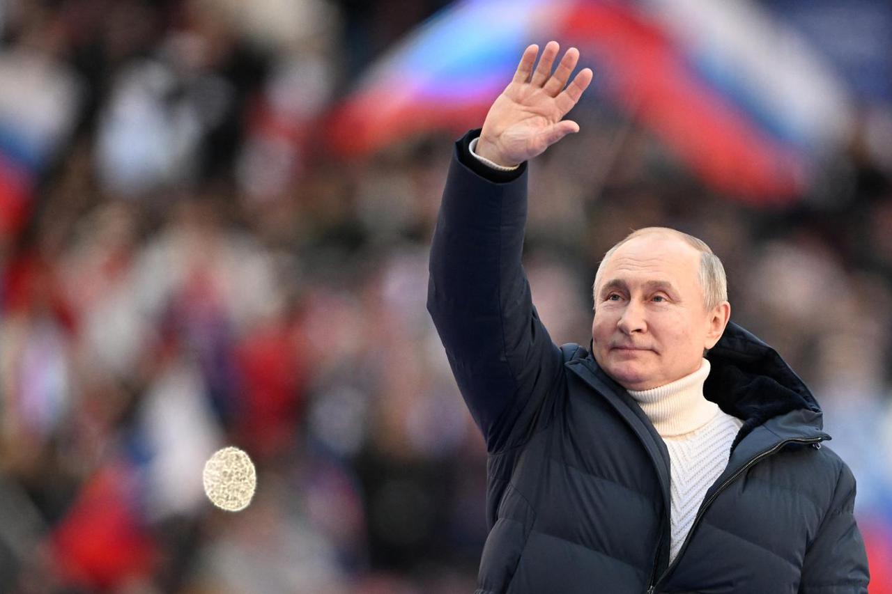 Russian President Vladimir Putin attends a concert marking the eighth anniversary of Russia's annexation of Crimea in Moscow