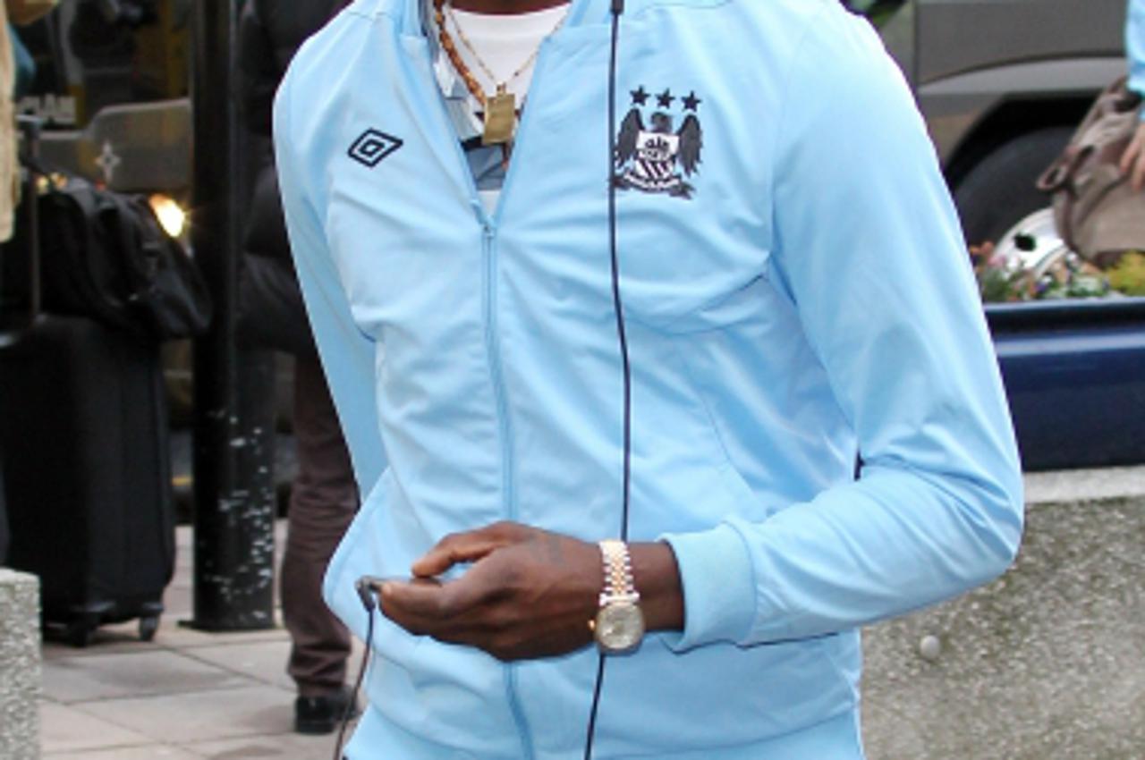 'Mario Balotelli, Man City, seen at Manchester airport before the team fly out to Dortmund, Germany. Photo: Press Association/Pixsell'