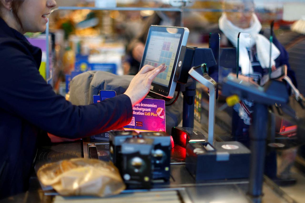 Customers shop in a Lidl supermarket near Nice