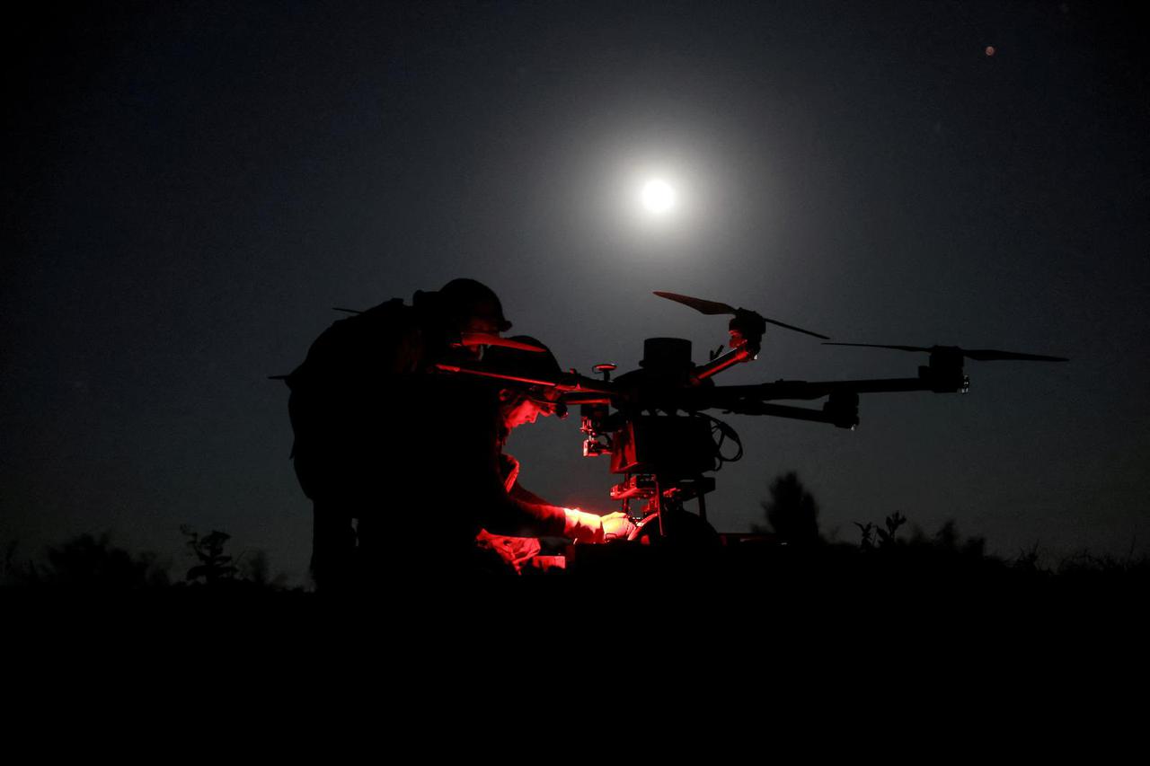 FILE PHOTO: Ukrainian servicemen prepare a heavy combat drone before flying it over positions of Russian troops near the frontline town of Chasiv Yar