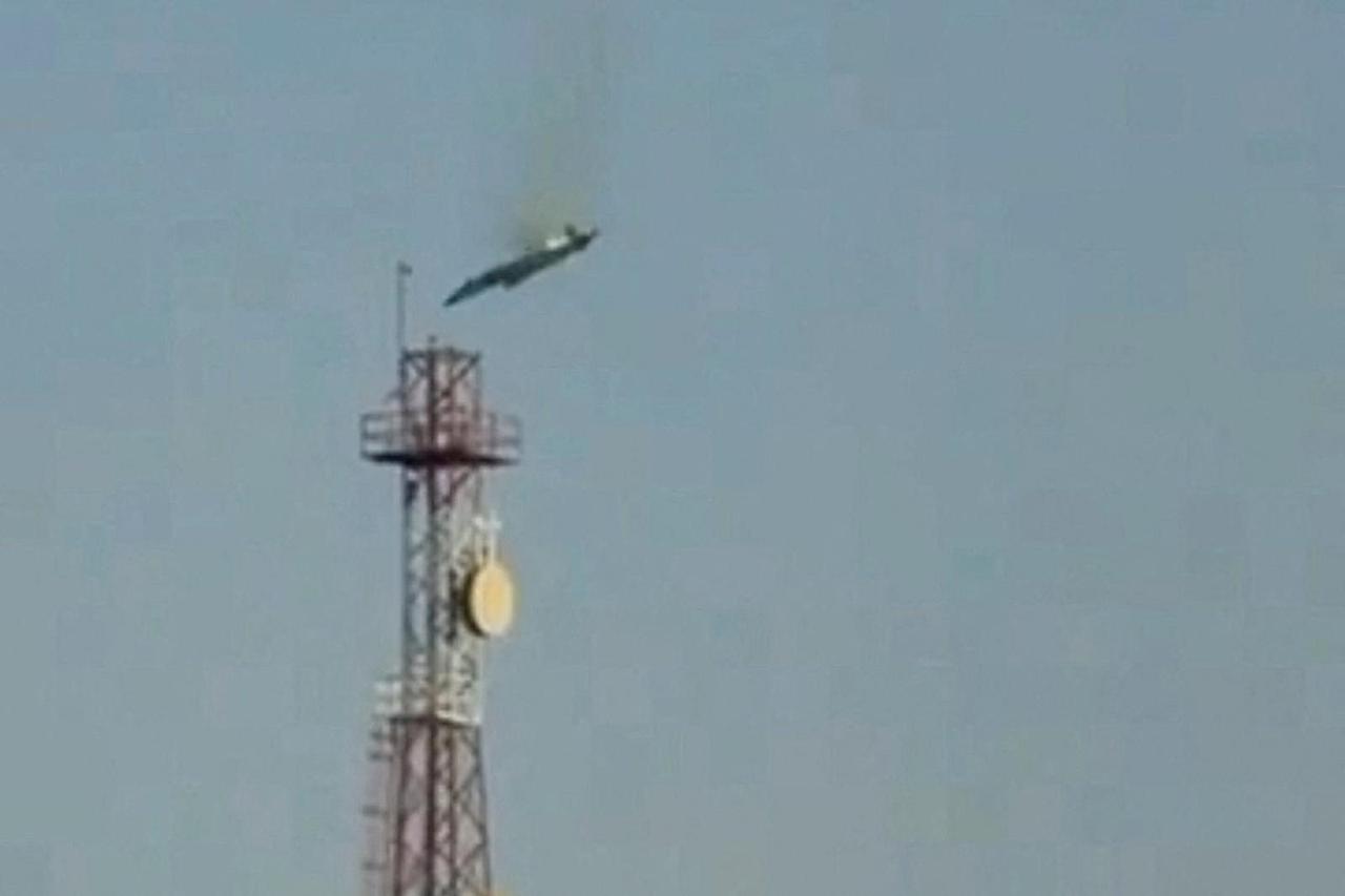 A burning aircraft falls from the sky in Al Jahra, in this still image obtained from social media video