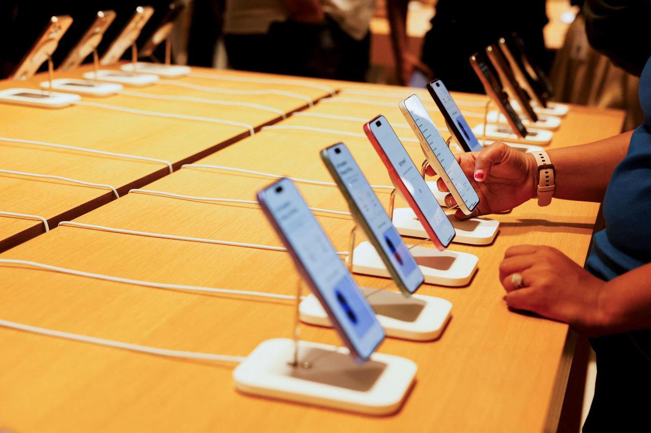 A person holds an Apple iPhone at the company's first retail store in Bengaluru