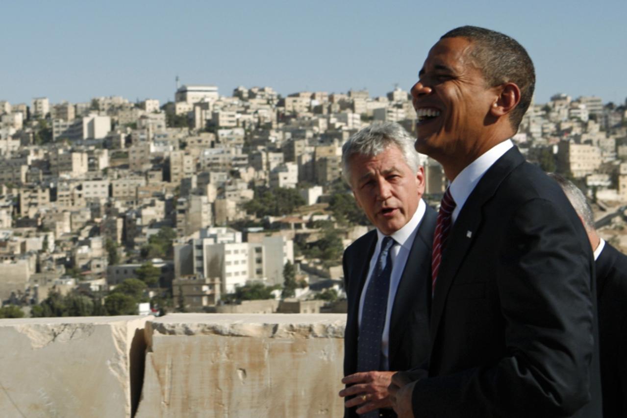 'US Democratic presidential candidate Senator Barack Obama (D-IL) (R) shares a laugh with Senator Chuck Hagel (R-NE) at the Amman Citadel in Amman, Jordan, in this July 22, 2008, file photo. President