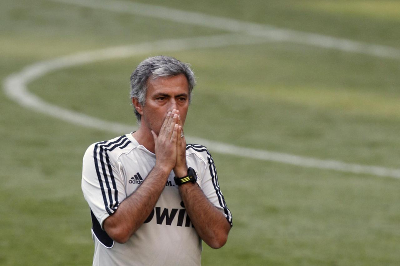 'Real Madrid\'s coach Jose Mourinho gestures during their training ahead of the Supercup meeting with European and domestic champions Barcelona at the Santiago Bernabeu stadium in Madrid August 13, 20
