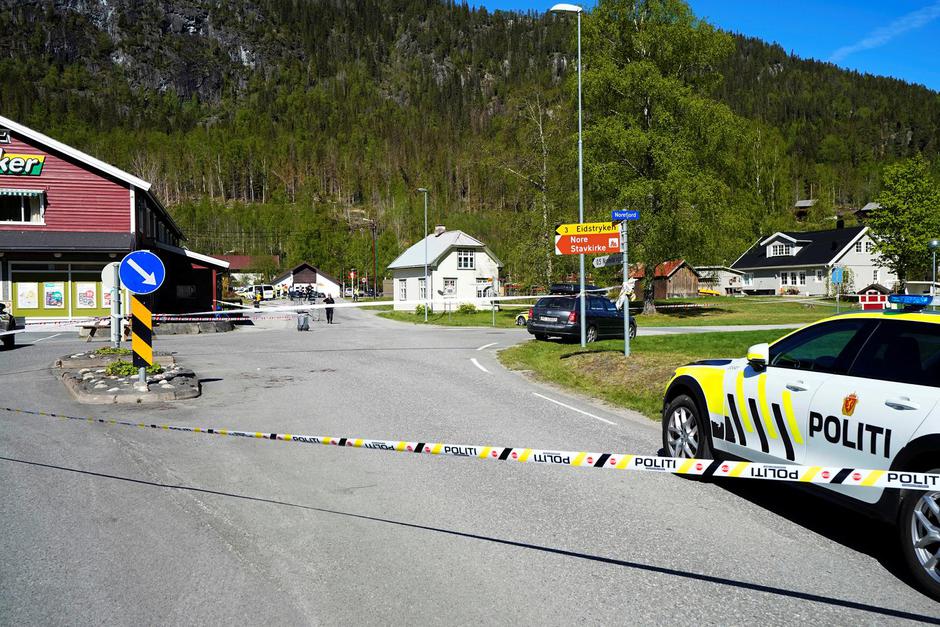 A police vehicle is parked on the side of the road following stabbing attacks, in Nore, Numedal region
