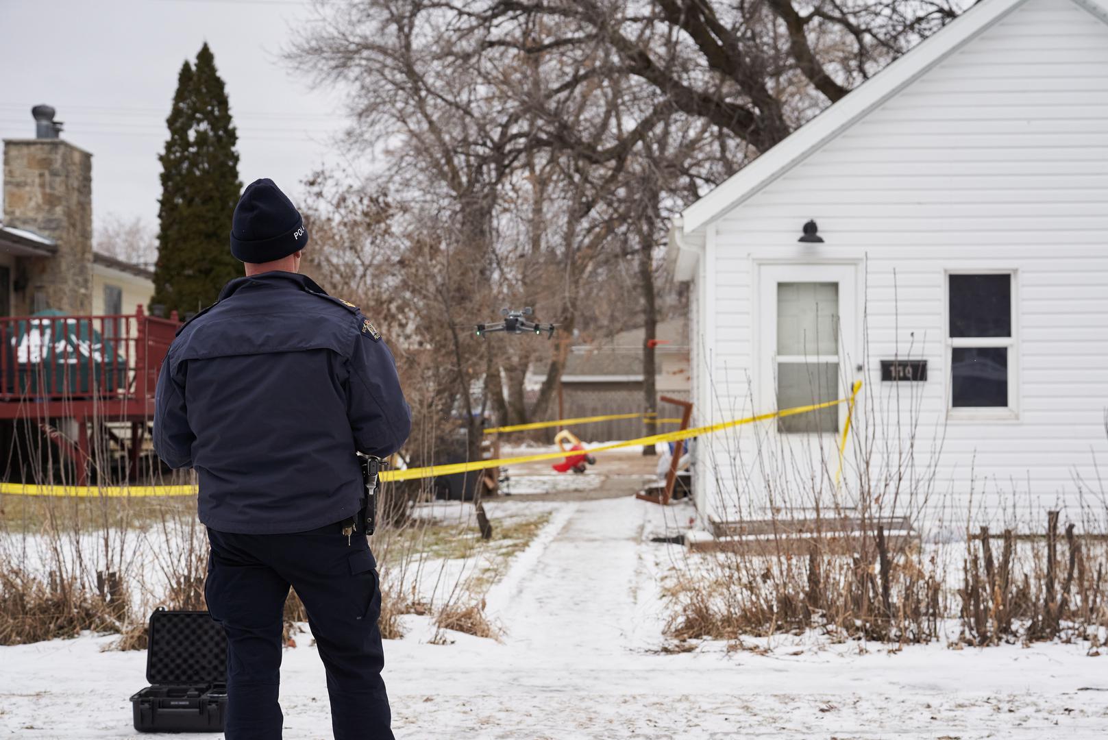 RCMP fly a drone at the scene of an ongoing investigation regarding five deaths in southern Manitoba, in Carman, Man., Monday, Feb. 12, 2024. THE CANADIAN PRESS/David Lipnowski
