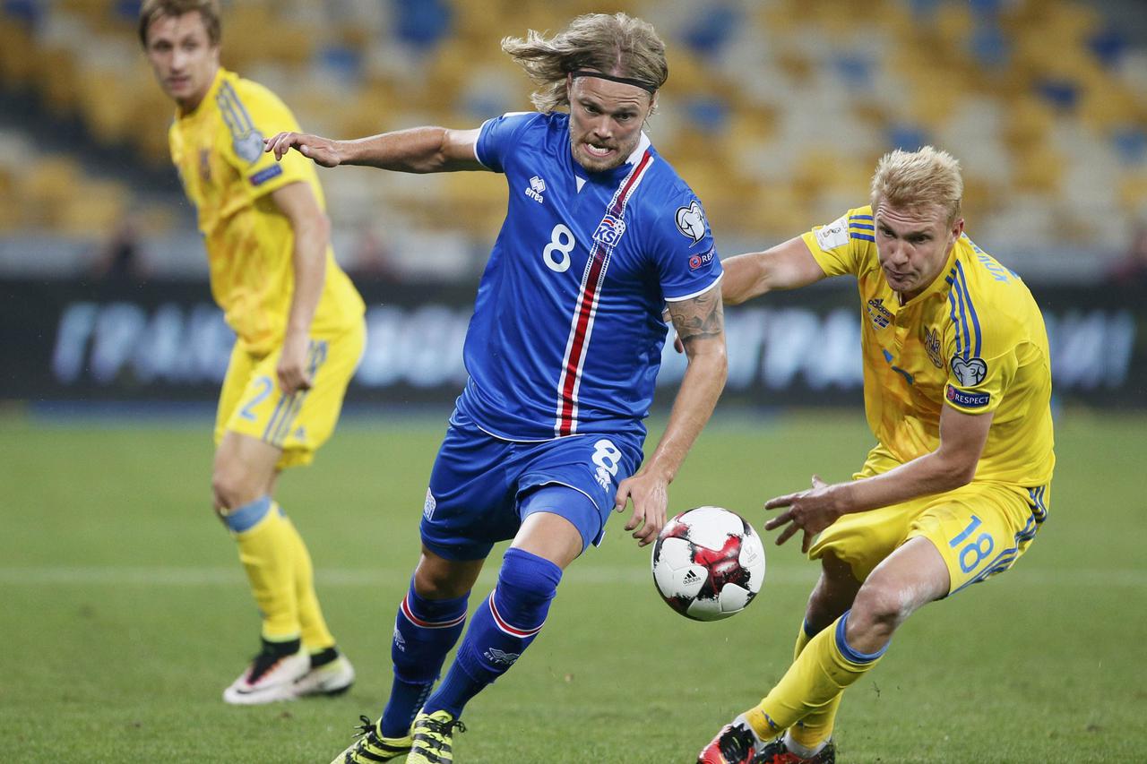 Football Soccer - Ukraine v Iceland - World Cup 2018 Qualifiers - NSC Olimpiyskiy Stadium, Kiev, Ukraine - 5/9/16 - Iceland's Birkir Bjarnason in action against Ukraine's Viktor Kovalenko.  REUTERS/Gleb Garanich  Picture Supplied by Action Images