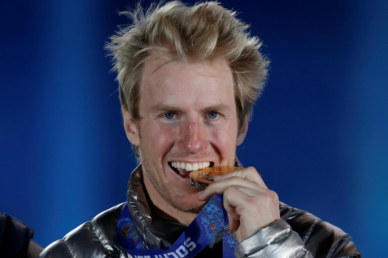 FILE PHOTO: Gold medallist Ligety of U.S. celebrates during victory ceremony for men's alpine skiing giant slalom event at 2014 Sochi Olympic Games