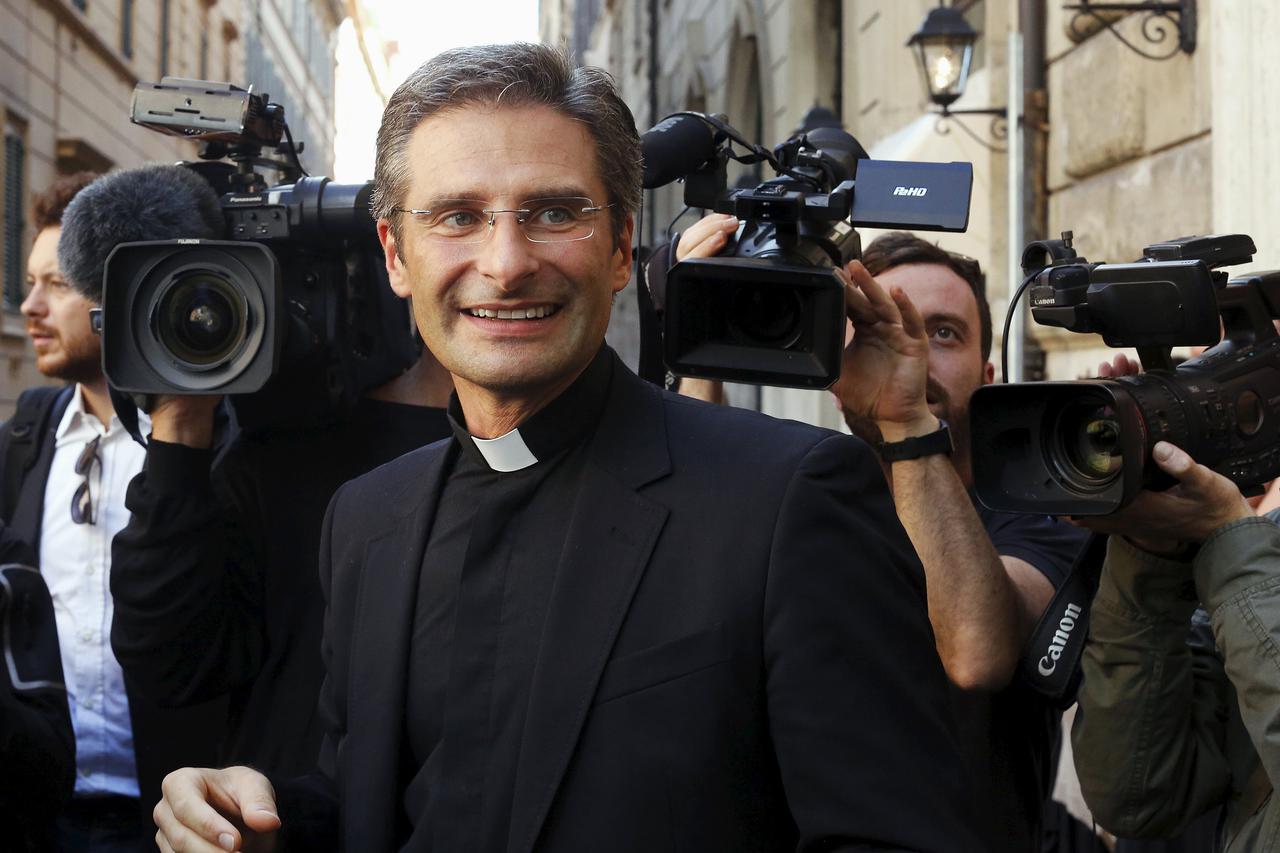 Monsignor Krzystof Charamsa smiles as he leaves at the end of his news conference in downtown Rome October 3, 2015. The Vatican dismissed Monsignor Charamsa from his post in a Holy See office on Saturday after he told a newspaper he was gay and urged the 