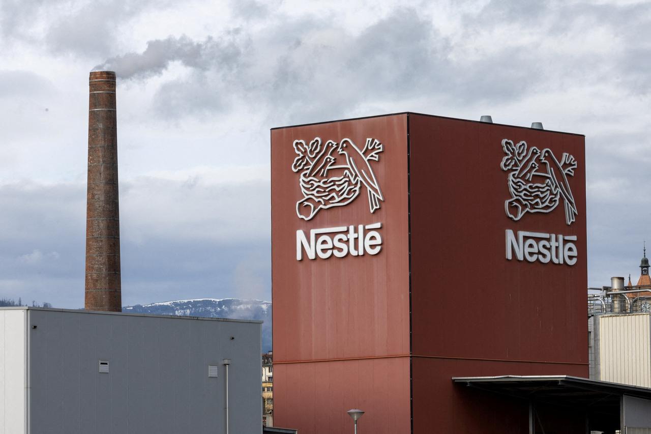 FILE PHOTO: A logo of food giant Nestle is seen in a building in Orbe