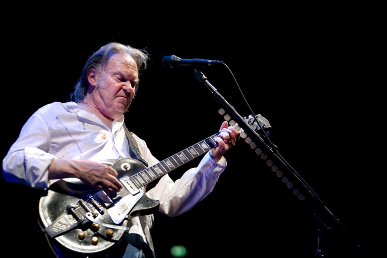 'Canadian singer Neil Young performs in Ahoy concerthall in Rotterdam, on June 7, 2009.  AFP PHOTO/ANP ROBIN UTRECHT netherlands out - belgium out'