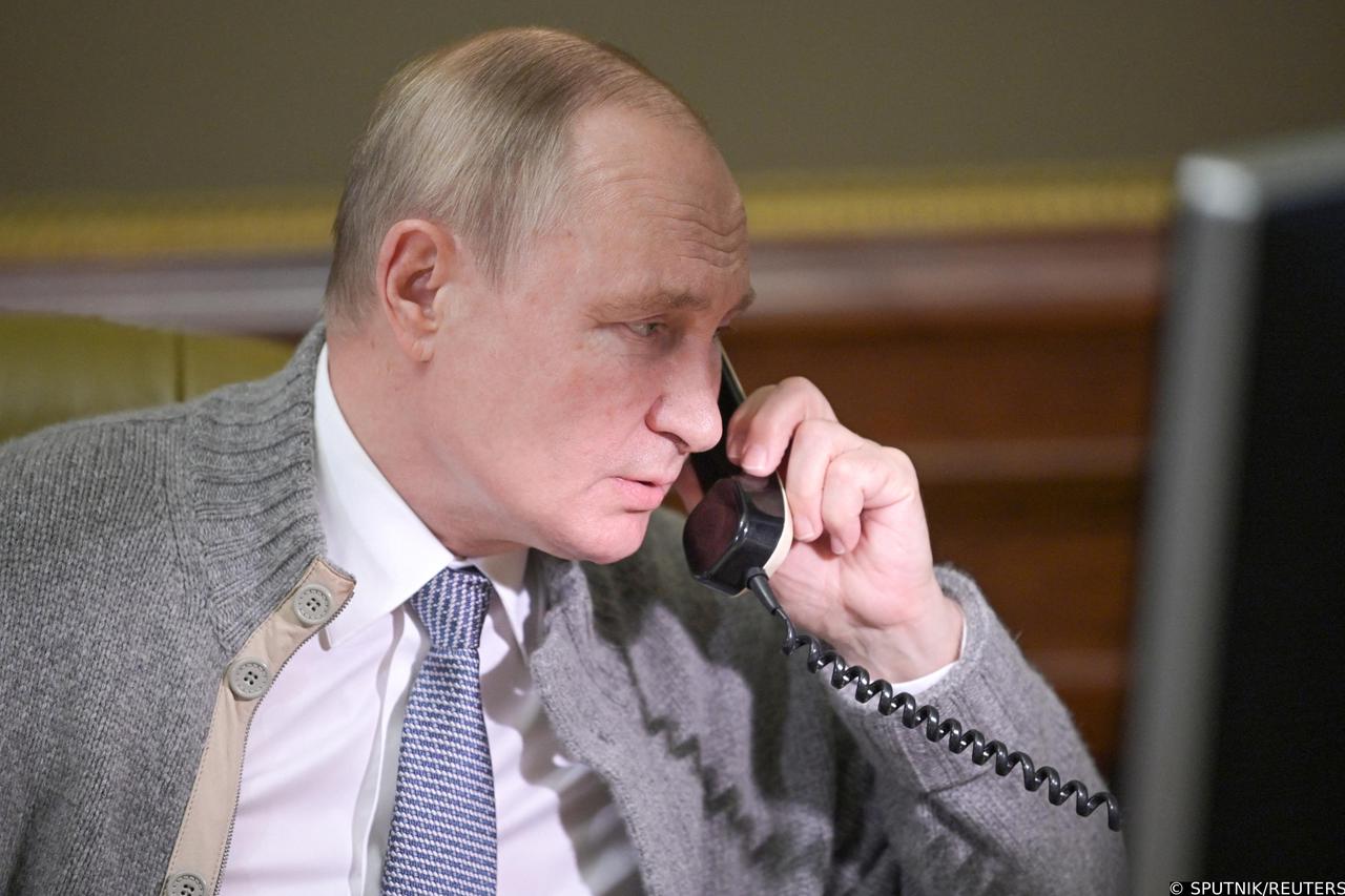 Russian President Putin speaks with a participant of a Christmas charity event in St Petersburg