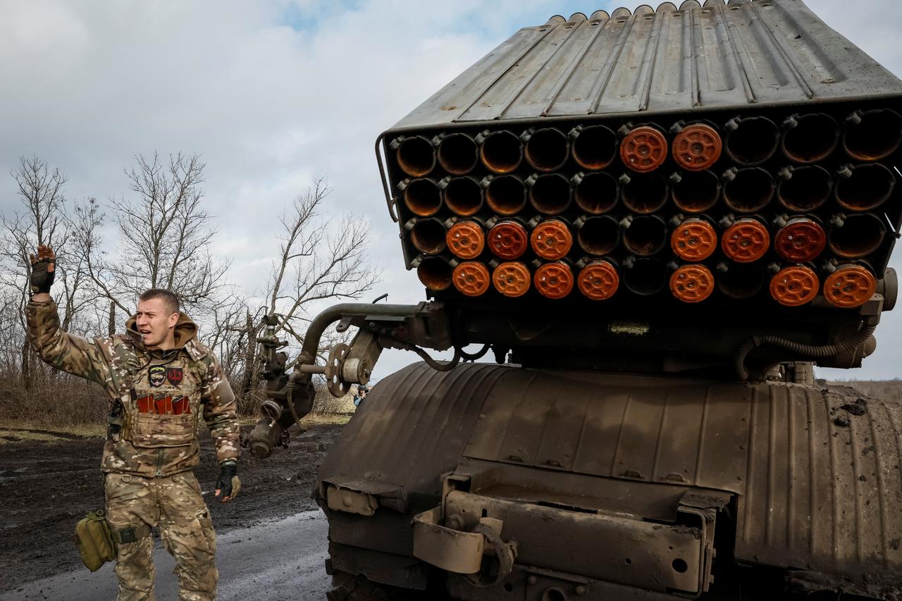 Ukrainian serviceman fires a BM-21 Grad multiple launch rocket system towards Russian troops in Donetsk region