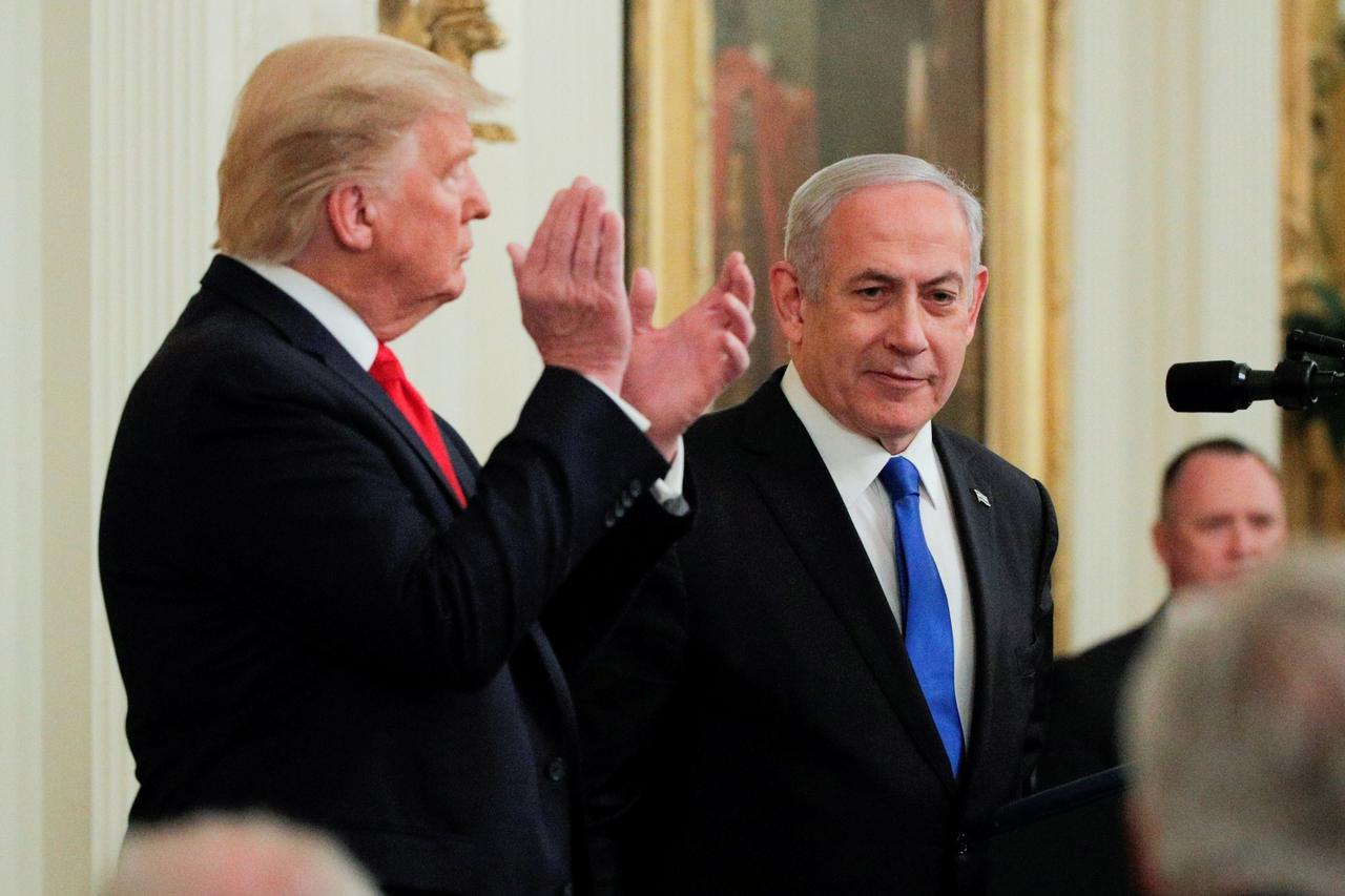 FILE PHOTO: U.S. President Trump applauds Israel's Prime Minister Netanyahu at Middle East peace proposal news conference at White House in Washington