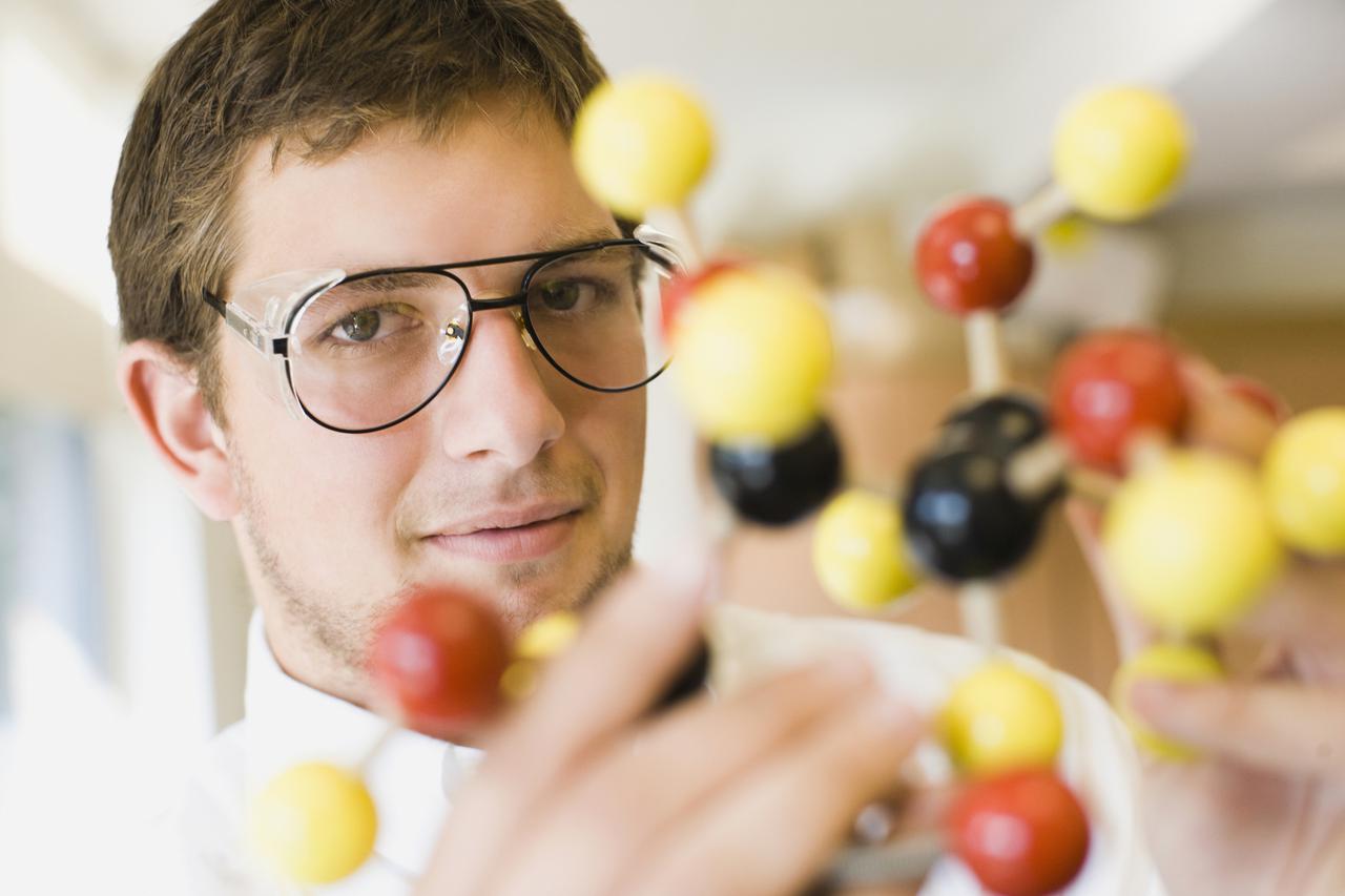 Student holding a molecular model