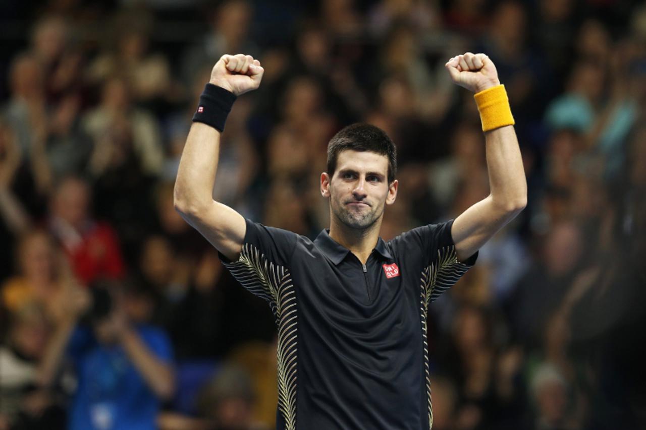 'Serbia\'s Novak Djokovic celebrates his win over Czech Republic\'s Tomas Berdych following their men\'s singles tennis match at the ATP World Tour Finals at the O2 Arena in London November 9, 2012. R