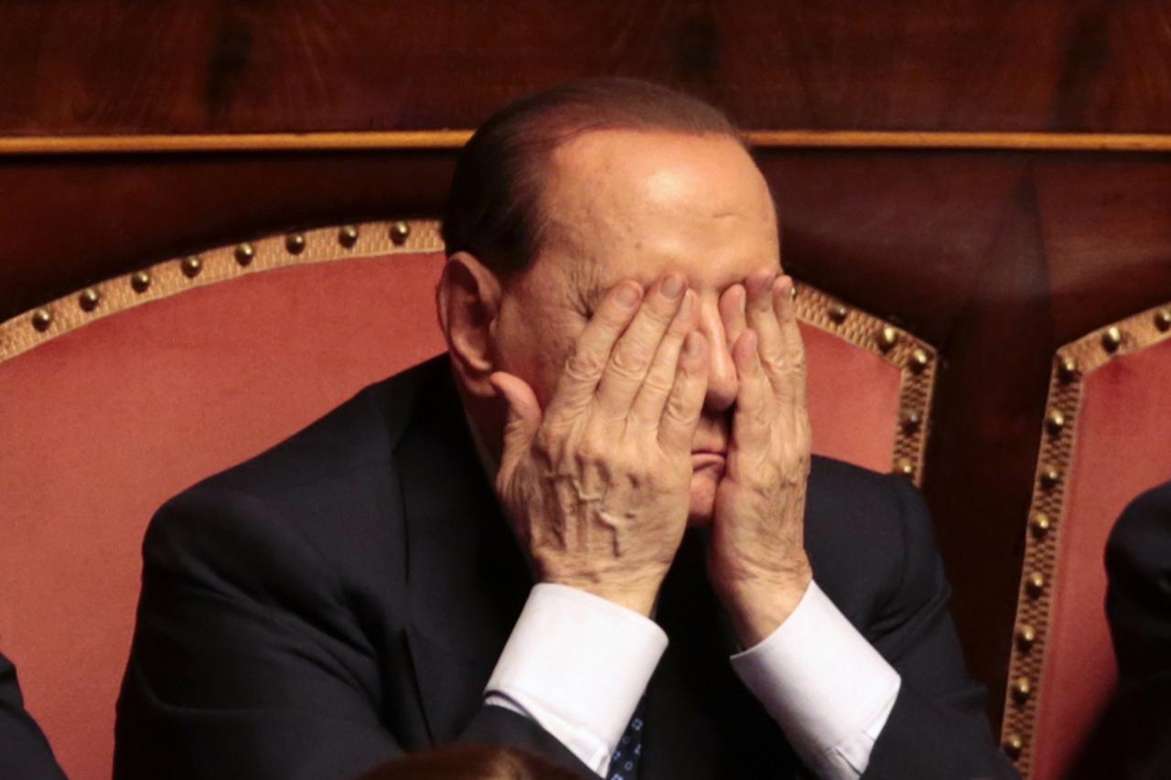 'Italian center-right leader Silvio Berlusconi gestures during a confidence vote at the Senate in Rome, October 2, 2013. Berlusconi promised to support Prime Minister Enrico Letta in a confidence vote