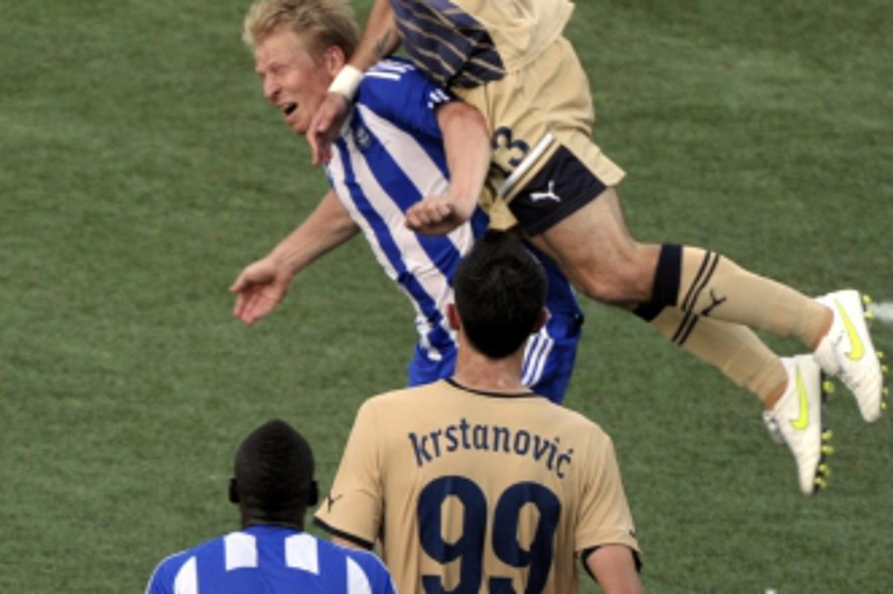 '(top to L) Tonel of Dinamo, Aki Riihilahi of HJK Helsinki and Ivan Krstanovic of Dinamo are in cation during UEFA Champions League third round, first leg football match HJK Helsinki vs Dinamo Zagreb 
