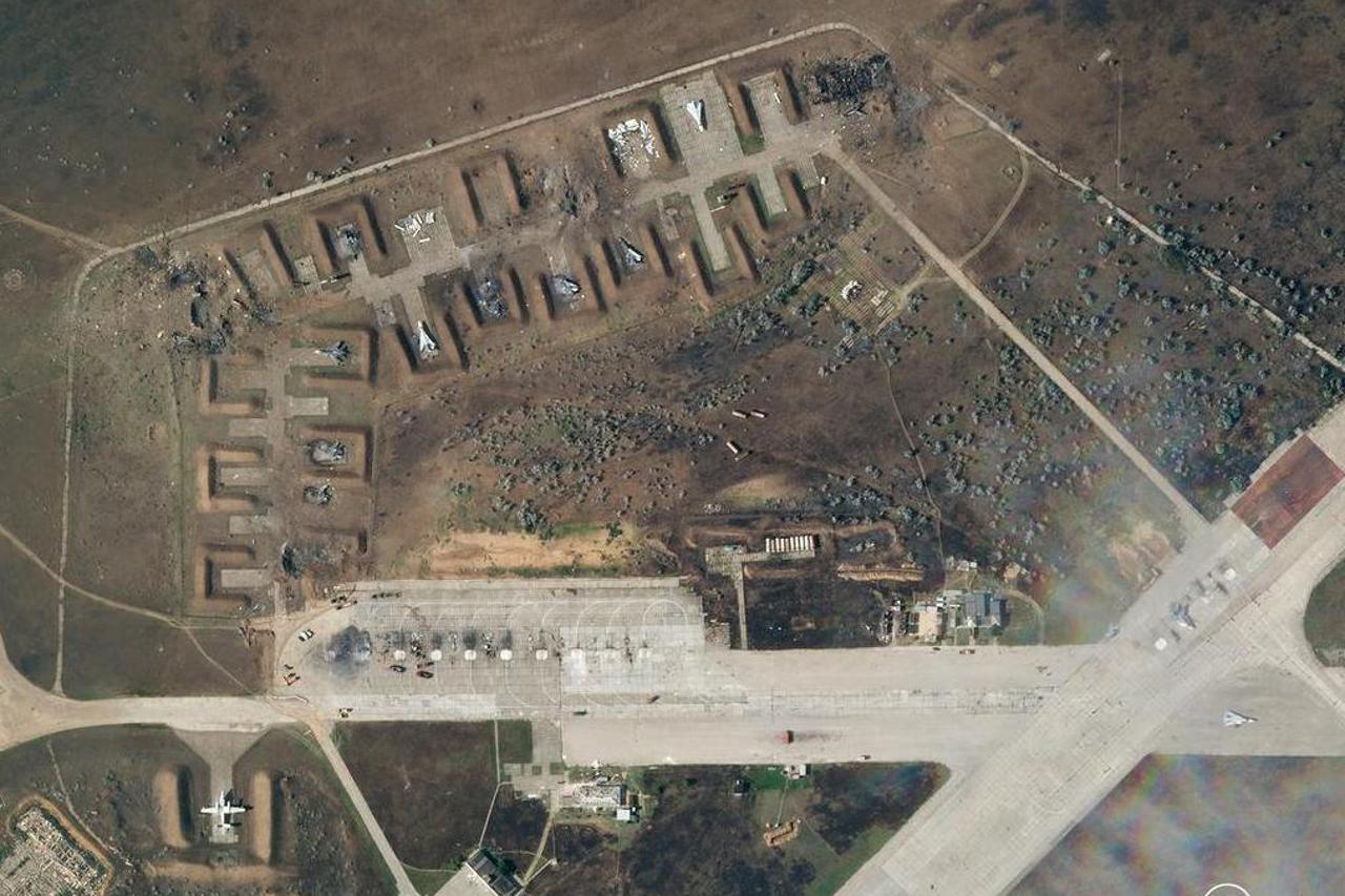 A combination photo shows satellite images of Saky air base in Crimea