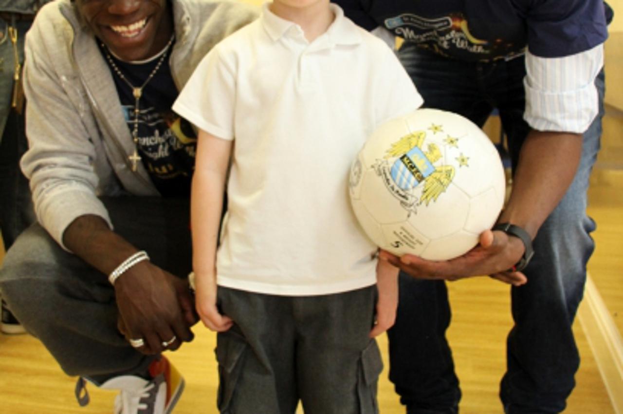 'Manchester City\'s Patrick Vieira (right) and Mario Balotelli during a visit to St Ann\'s Hospice in Heald Green, Manchester Photo: Press Association/Pixsell'