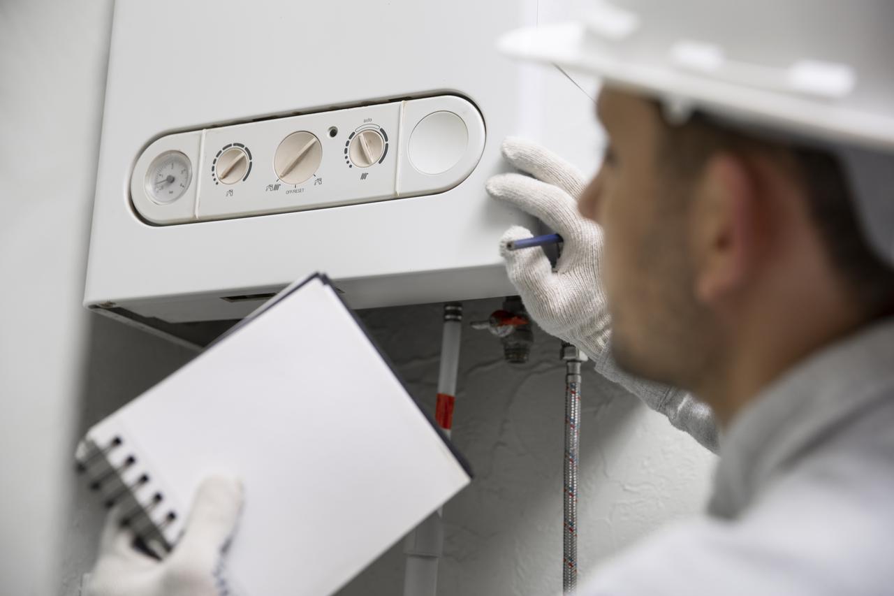 storyeditor/2026-10-21/worker-repairing-water-heater.jpg
