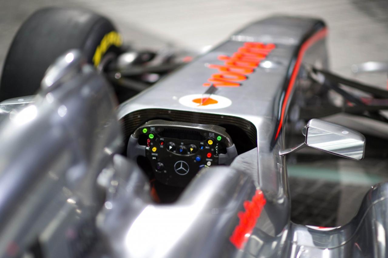 'The new McLaren Mercedes MP4-26 racing car is pictured during its reveal on February 4, 2010 in Berlin.   AFP PHOTO / JOHANNES EISELE '