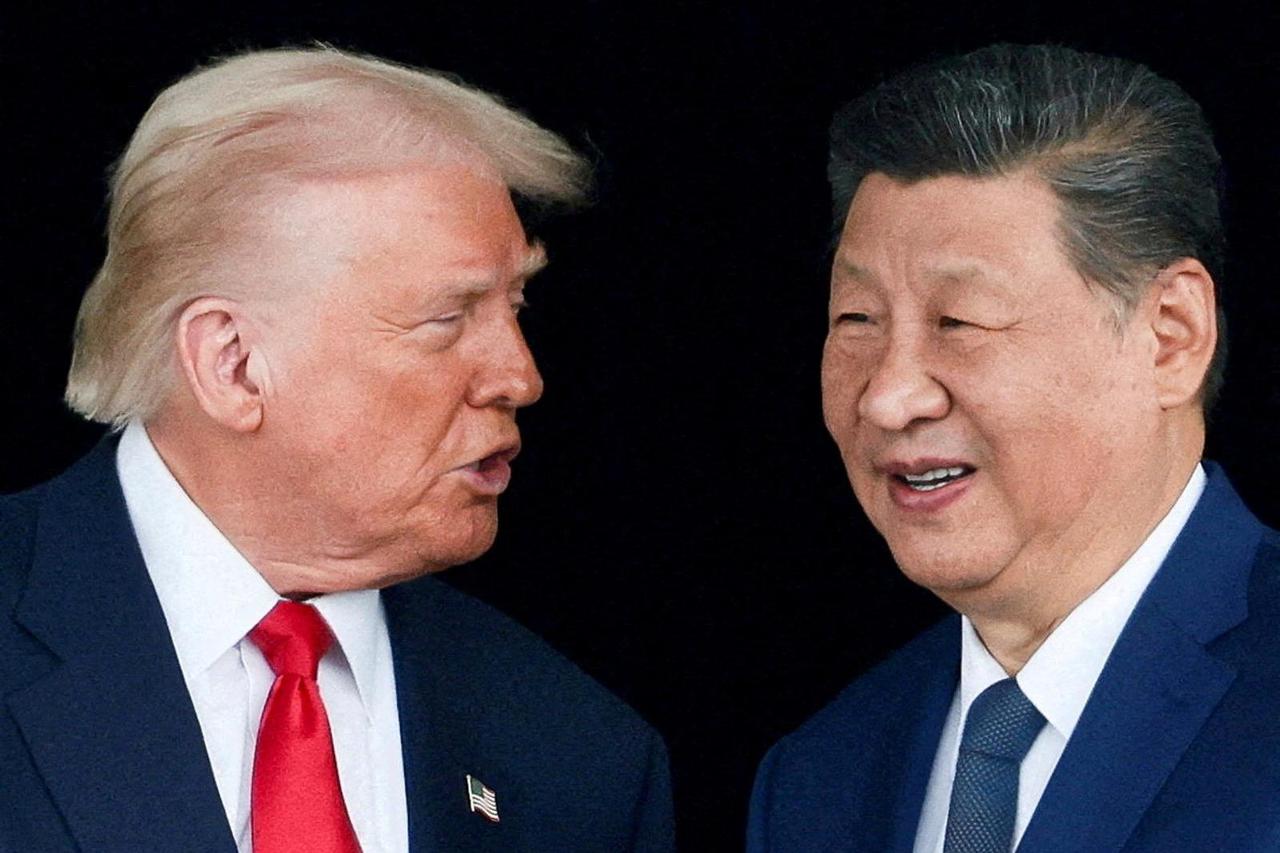FILE PHOTO: U.S. President Donald Trump meets with Chinese President Xi Jinping on the sidelines of the APEC summit, in Busan