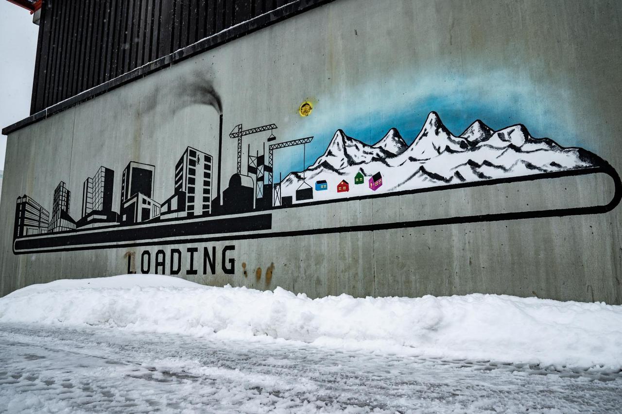 Wall painting with modern times vs traditional way of life is seen in Nuuk