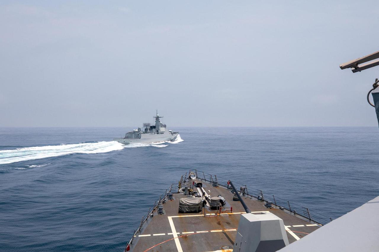 FILE PHOTO: Chinese warship sails near U.S. destroyer, in the Taiwan Strait