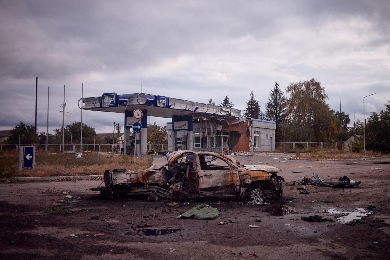 A destroyed car is seen in the town of Balakliia in Kharkiv region, Ukraine