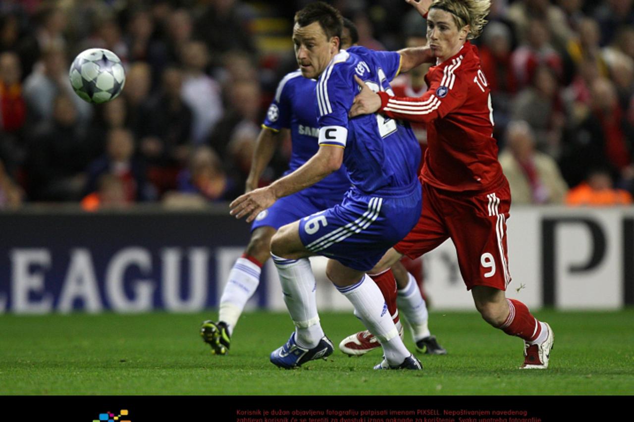 \'Soccer - UEFA Champions League - Quarter Final - First Leg - Liverpool v Chelsea - Anfield Chelsea\'s John Terry and Liverpool\'s Fernando Torres (right)  battle for the ball\'