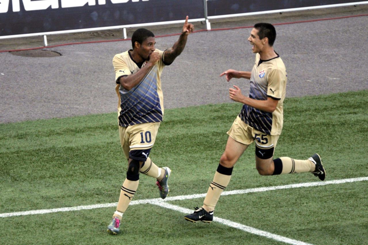 'Sammir (L) of Dinamo celebrates his 2-1 goal against HJK with teammate Ante Rukavina during their UEFA Champions League match in Helsinki, Finland, July 27, 2011.  REUTERS/Kimmo Mantyla/Lehtikuva (FI
