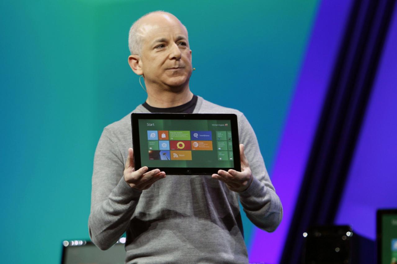 'Microsoft Windows President Steven Sinofsky introduces the new tablet running a test version of its touch-enabled Windows 8 at the Build conference in Anaheim, California September 13, 2011.  REUTERS