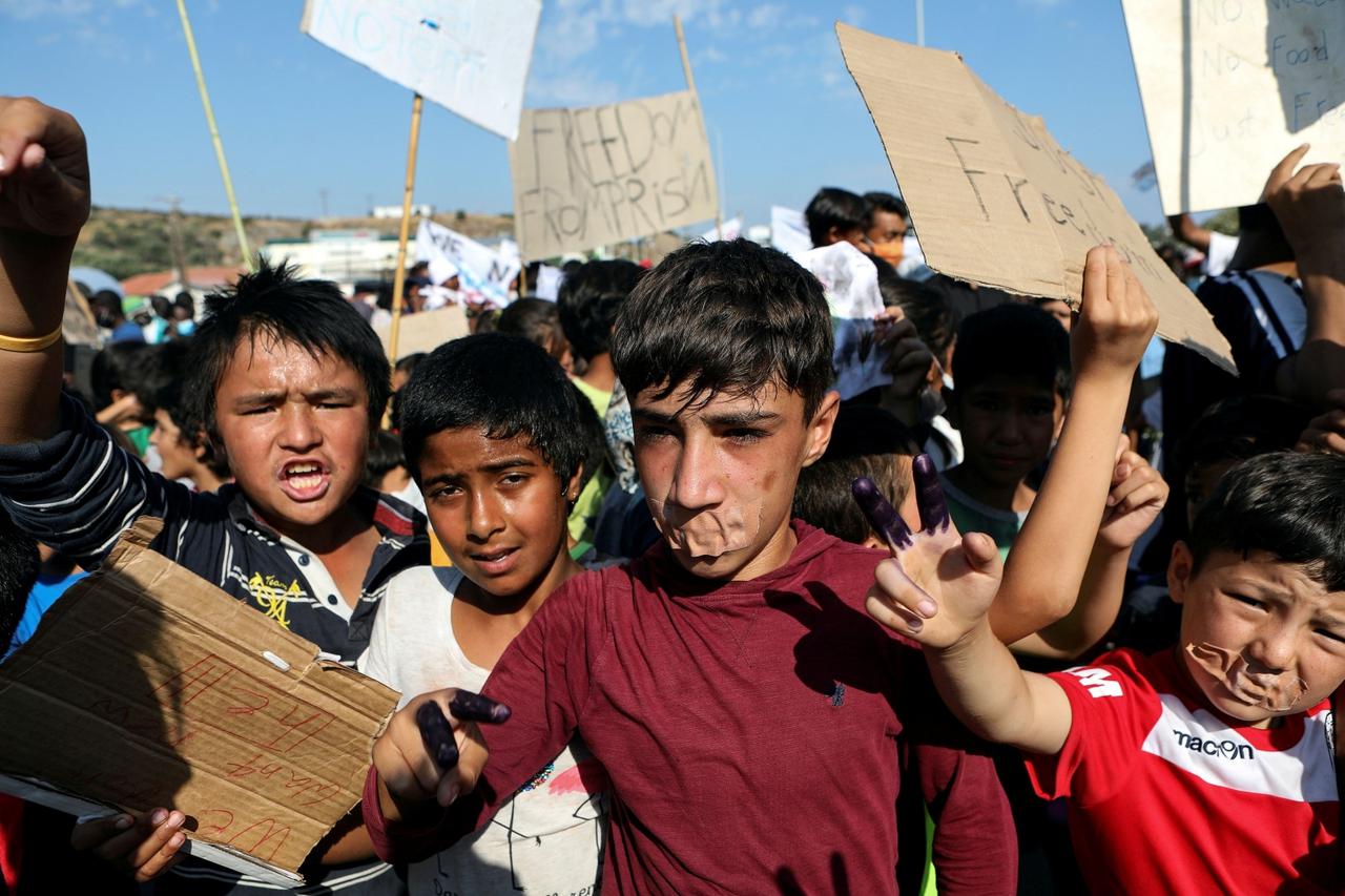 Refugees and migrants from the destroyed Moria camp protest on the island of Lesbos