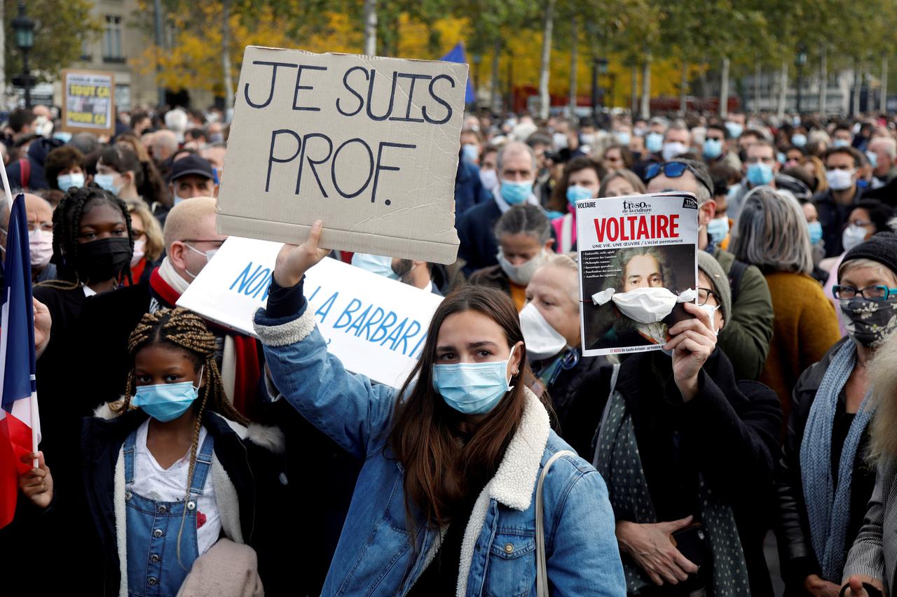 FILE PHOTO: People pay tribute to beheaded teacher Samuel Paty in Paris