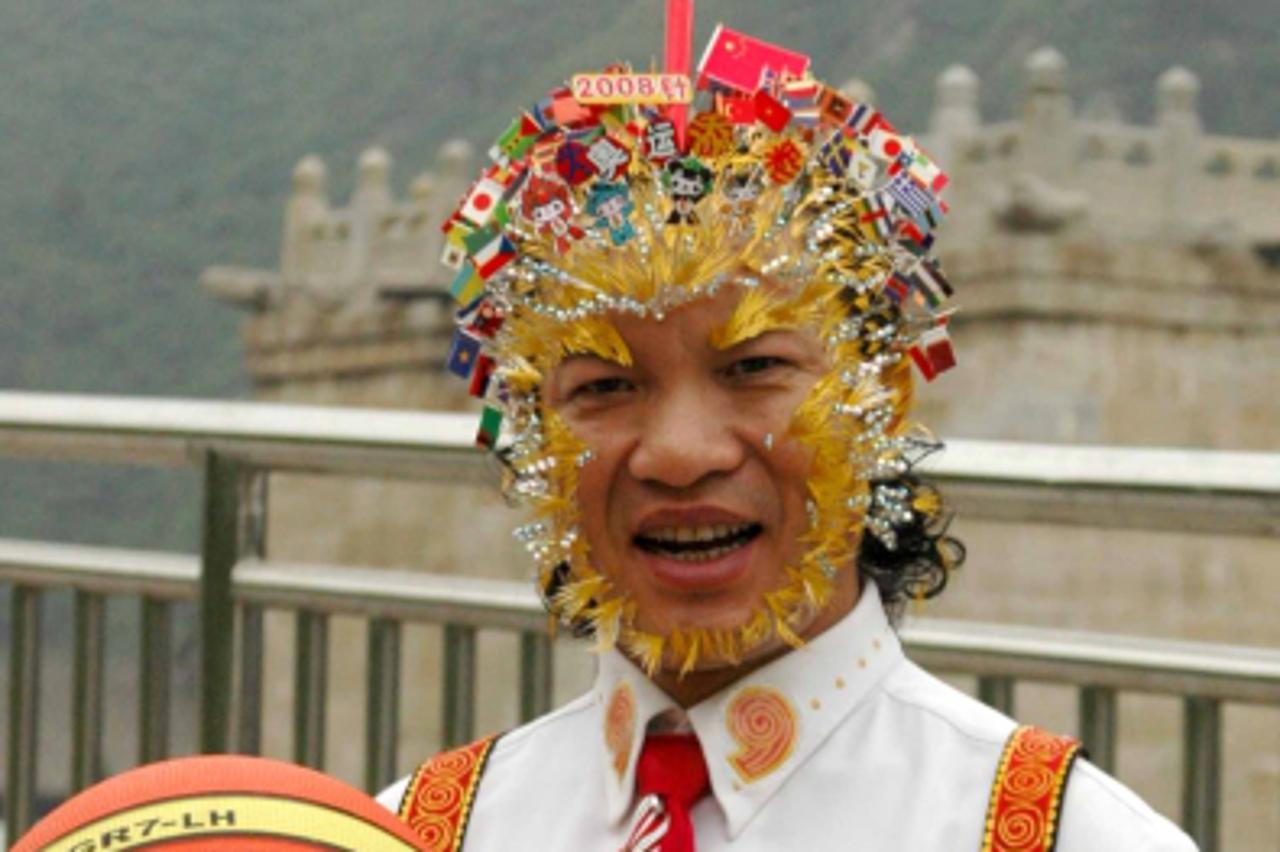 'Chinese doctor and acupuncturist Wei Shengchu, 61, shows 2008 needles inserted in his head to support the Beijing 2008 Olympic Games in Beijing, 30 July 2008.  Wei Shengchu, who comes from south Chin