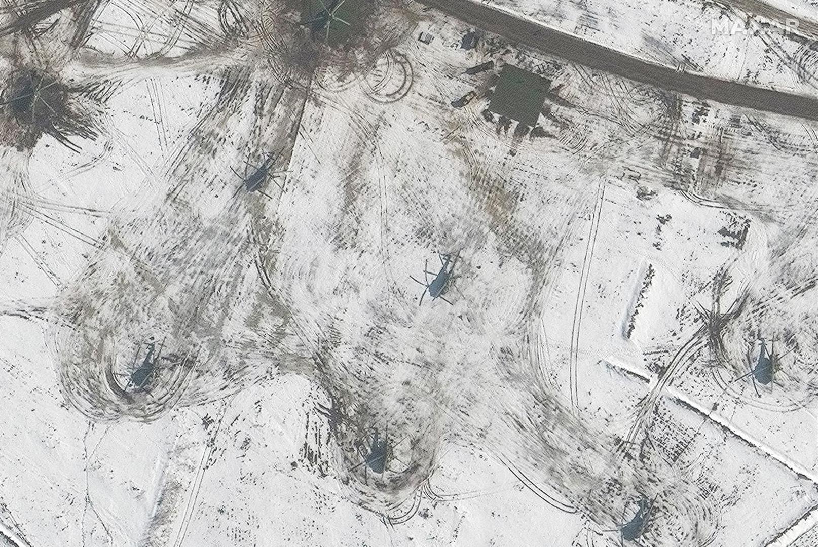 A satellite image shows a closer view of a helicopter deployment, in Valuyki, Russia February 20, 2022. Maxar Technologies/Handout via REUTERS ATTENTION EDITORS - THIS IMAGE HAS BEEN SUPPLIED BY A THIRD PARTY. NO RESALES. NO ARCHIVES. MANDATORY CREDIT. DO NOT OBSCURE LOGO Photo: MAXAR TECHNOLOGIES/REUTERS