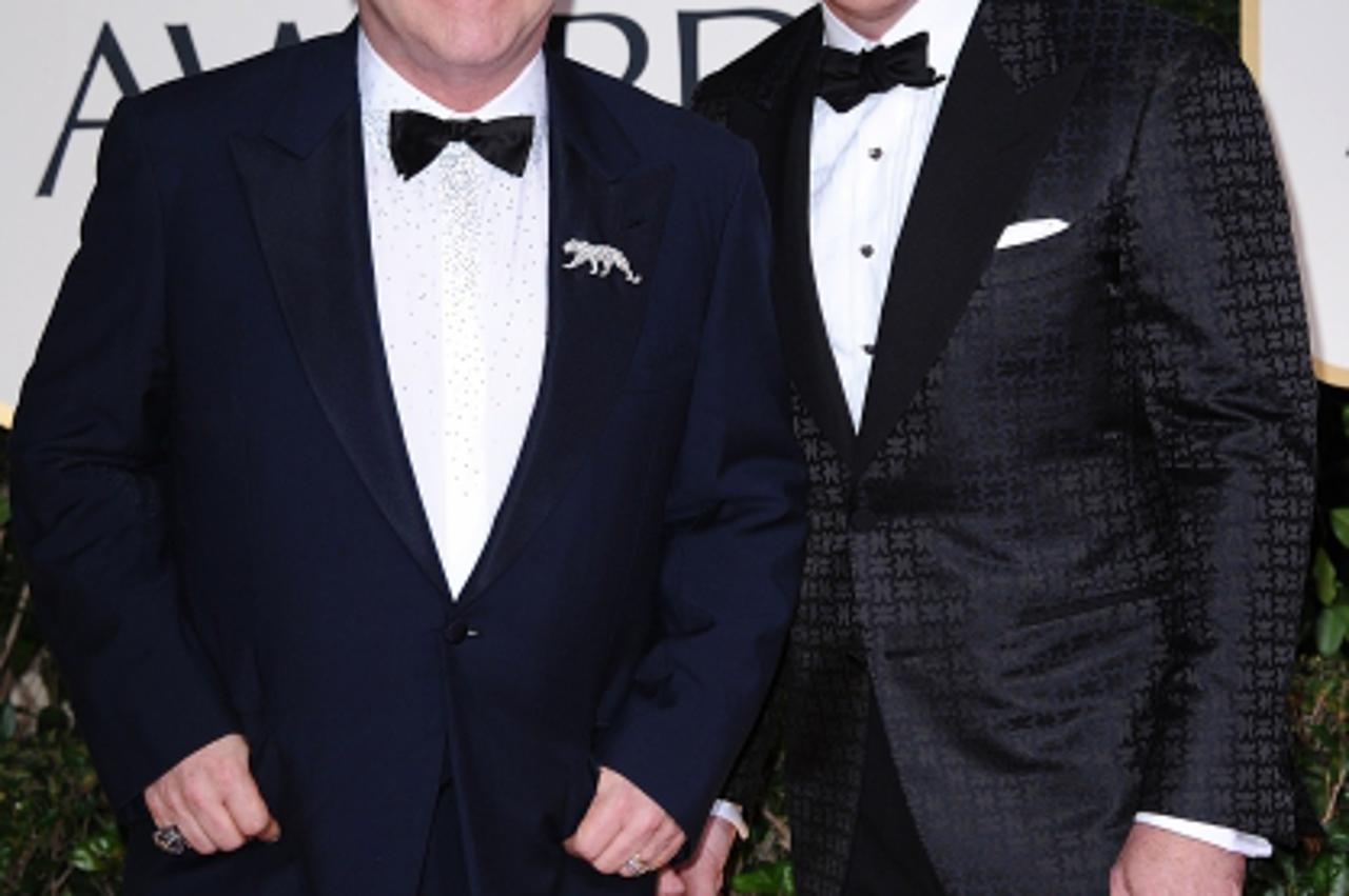 'Elton John and David Furnish arriving for the 69th Annual Golden Globe Awards Ceremony, held at the Beverly Hilton Hotel in Los Angeles, CA on January 15, 2011. Photo: Press Association/Pixsell'