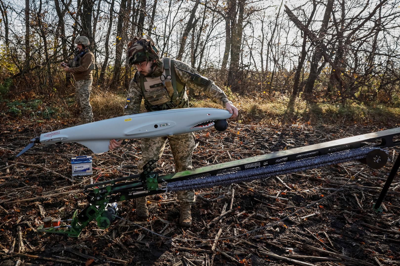 Serviceman of the 15th Separate Artillery Reconnaissance Brigade of the Armed Forces of Ukraine, callsign Buryi, 30-years-old, mounts a Shark drone before launching, amid Russia's attack on Ukraine, in Kharkiv region, Ukraine, October 30, 2023. REUTERS/Alina Smutko Photo: ALINA SMUTKO/REUTERS