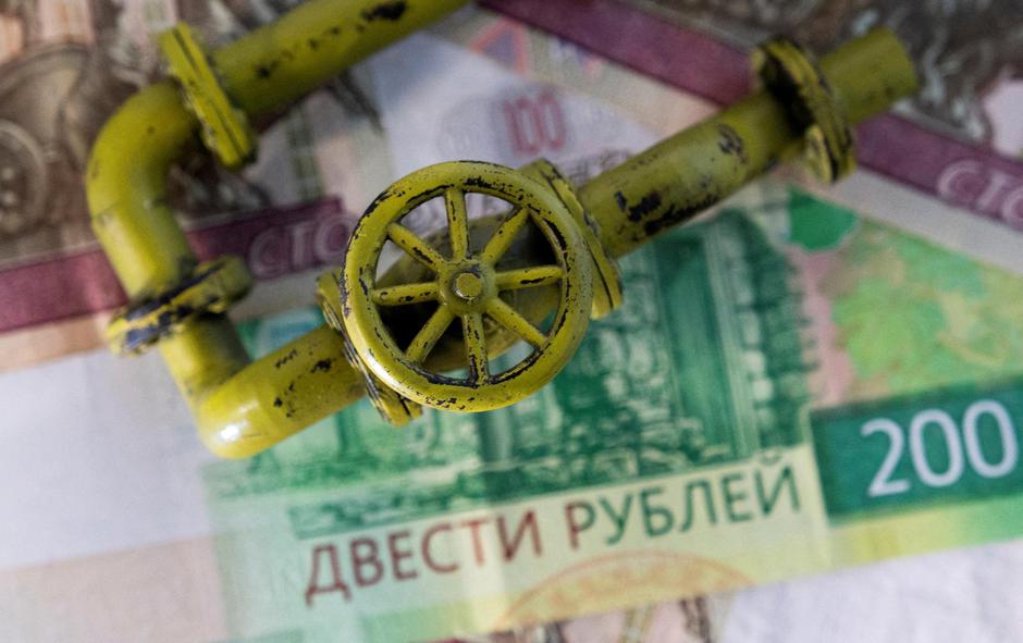 FILE PHOTO: Illustration shows natural gas pipeline, Russian Rouble banknotes