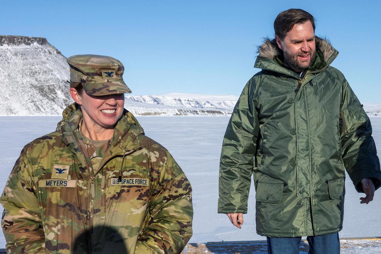 U.S. Vice President JD Vance walks with Col. Susannah Meyers, commander of the U.S. military's Pituffik Space Base, as they tour the base in Greenland