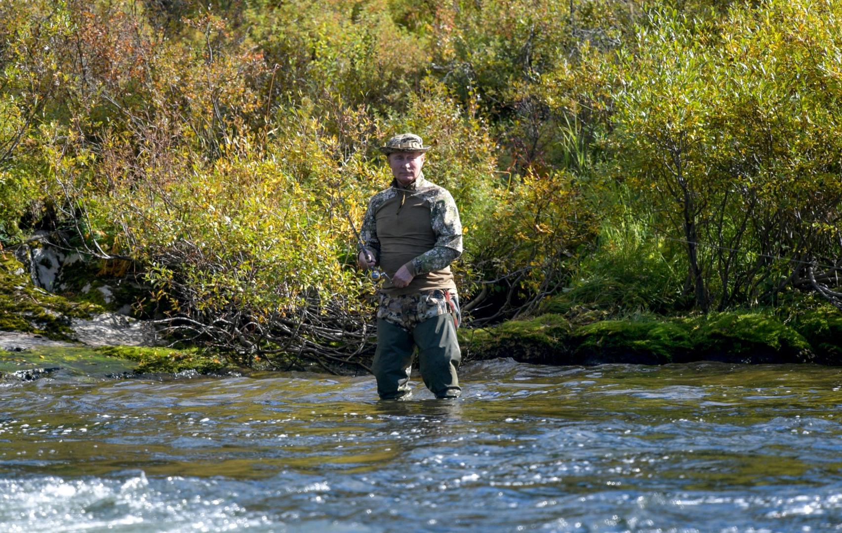 Russian President Vladimir Putin spends vacations in Siberia Russian President Vladimir Putin fishes during a short vacation at an unknown location in Siberia, Russia, in this undated photo taken in September 2021 and released September 26, 2021. Sputnik/Alexei Druzhinin/Kremlin via REUTERS  ATTENTION EDITORS - THIS IMAGE WAS PROVIDED BY A THIRD PARTY. SPUTNIK