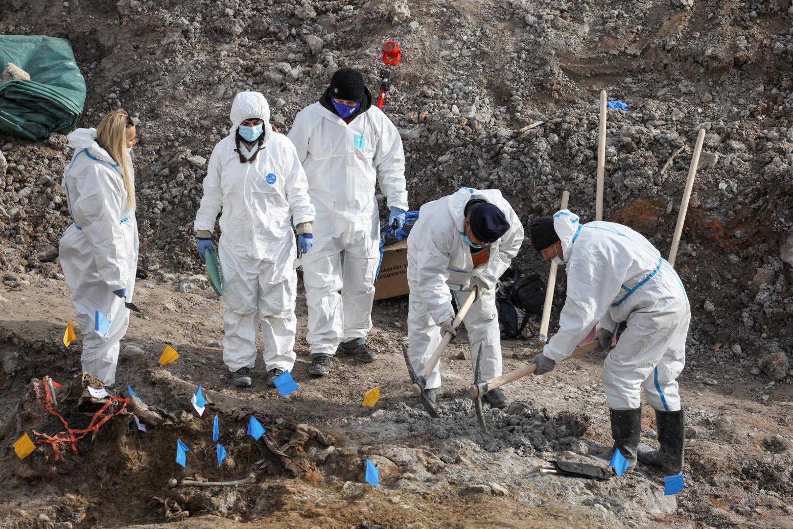 Serbia unearths mass grave from Kosovo war Forensics search for the human remains believed to be the bodies of over a dozen ethnic Albanians killed during the 1998-99 war in Kosovo outside the village of Kizevak, near Raska, Serbia, December 4, 2020. REUTERS/Fedja Grulovic FEDJA GRULOVIC